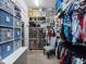 Well-organized walk-in closet with shoe storage and hanging rods at 4904 W Fountainwood Dr, St Cloud, FL 34772