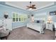 Main bedroom with king bed, and window seat at 4904 W Fountainwood Dr, St Cloud, FL 34772