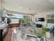 Relaxing outdoor kitchen, hot tub, and seating area at 4904 W Fountainwood Dr, St Cloud, FL 34772