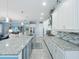 Spacious kitchen boasts granite island and stainless steel appliances at 4904 W Fountainwood Dr, St Cloud, FL 34772