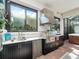 Outdoor kitchen with stainless steel appliances and granite countertops at 4904 W Fountainwood Dr, St Cloud, FL 34772