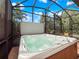 Relaxing hot tub in screened lanai at 4904 W Fountainwood Dr, St Cloud, FL 34772