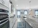 Modern kitchen with granite countertops and stainless steel appliances at 4904 W Fountainwood Dr, St Cloud, FL 34772