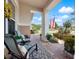 Relaxing front porch with seating area overlooking the street and neighborhood at 4904 W Fountainwood Dr, St Cloud, FL 34772