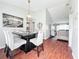 Modern dining room with a view into the living room at 2520 Woodgate Blvd # 204, Orlando, FL 32822