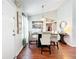 Cozy dining area featuring a wood floor and a stylish light fixture at 2520 Woodgate Blvd # 204, Orlando, FL 32822