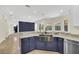 Open kitchen showcasing granite countertops and stainless steel appliances at 11514 Via Lucerna Cir, Windermere, FL 34786
