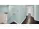 Upstairs hallway with light blue walls and hardwood floors at 11514 Via Lucerna Cir, Windermere, FL 34786
