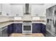 Modern kitchen with stainless steel appliances and two-toned cabinetry at 11514 Via Lucerna Cir, Windermere, FL 34786