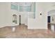 Bright and spacious two-story foyer with elegant staircase and tile flooring at 11514 Via Lucerna Cir, Windermere, FL 34786