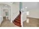 Elegant wooden staircase with white railing in a two-story home at 11514 Via Lucerna Cir, Windermere, FL 34786