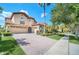 Two-story home with a tile roof, large driveway and landscaping at 11514 Via Lucerna Cir, Windermere, FL 34786