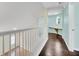 Upstairs hallway with built-in desk and wood floors at 11514 Via Lucerna Cir, Windermere, FL 34786