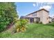 Spacious backyard with well-maintained lawn and garden at 11514 Via Lucerna Cir, Windermere, FL 34786