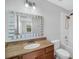 Bathroom with wood vanity and neutral color scheme at 11514 Via Lucerna Cir, Windermere, FL 34786