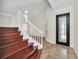 Elegant entryway with a modern door and a grand staircase at 11514 Via Lucerna Cir, Windermere, FL 34786