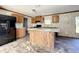 Open concept kitchen with island, granite countertops and stainless steel appliances at 40407 Sunset Dr, Eustis, FL 32736