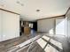 Spacious living room with wood-look floors and lots of natural light at 40407 Sunset Dr, Eustis, FL 32736