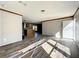 Spacious living area with wood-look floors and an island kitchen at 40407 Sunset Dr, Eustis, FL 32736