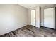 Simple bedroom with wood-look floors and double door closet at 40407 Sunset Dr, Eustis, FL 32736