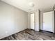 Simple bedroom with wood-look floors and ample closet space at 40407 Sunset Dr, Eustis, FL 32736