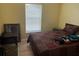 Bedroom with a double bed and red bedding at 3723 Imperial Dr, Winter Haven, FL 33880