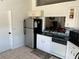 Bright kitchen features stainless steel appliances and granite countertops at 3723 Imperial Dr, Winter Haven, FL 33880