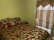 Bedroom with a double bed and red bedding at 3723 Imperial Dr, Winter Haven, FL 33880