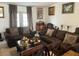 Spacious living room with two brown sofas and a coffee table at 3723 Imperial Dr, Winter Haven, FL 33880