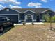 Beautiful blue house with a well-maintained lawn at 3723 Imperial Dr, Winter Haven, FL 33880