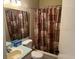 Bathroom with shower/tub combo and patterned shower curtain at 3723 Imperial Dr, Winter Haven, FL 33880