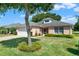 Charming single-story home with a well-maintained lawn at 4223 Arlington Ridge Blvd, Leesburg, FL 34748