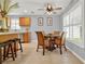 Casual dining area with wicker chairs and a glass-top table at 4223 Arlington Ridge Blvd, Leesburg, FL 34748