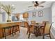 Bright dining area with glass-top table and wicker chairs at 4223 Arlington Ridge Blvd, Leesburg, FL 34748
