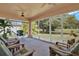 Relaxing screened porch overlooking backyard at 4223 Arlington Ridge Blvd, Leesburg, FL 34748