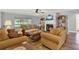 Bright living room with fireplace and view to backyard at 4223 Arlington Ridge Blvd, Leesburg, FL 34748
