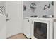 Laundry room with washer, dryer, and shelving at 4223 Arlington Ridge Blvd, Leesburg, FL 34748