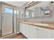 Double sink bathroom with a walk in shower at 4223 Arlington Ridge Blvd, Leesburg, FL 34748