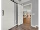 Hallway with barn door and view into living area at 4223 Arlington Ridge Blvd, Leesburg, FL 34748
