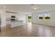 Open kitchen with island, granite countertops, stainless steel appliances, and view to backyard at 1167 Foreshore Ln, Haines City, FL 33844