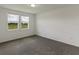 Well-lit bedroom with two windows, carpet flooring and neutral tones at 1167 Foreshore Ln, Haines City, FL 33844