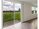 Bright interior with sliding glass doors opening to a grassy backyard patio at 1167 Foreshore Ln, Haines City, FL 33844