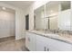 Double vanity bathroom with granite countertop and a walk-in shower at 1167 Foreshore Ln, Haines City, FL 33844