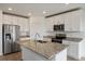 Open concept kitchen with stainless steel appliances and granite countertops at 1167 Foreshore Ln, Haines City, FL 33844