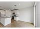Modern kitchen with white cabinets, granite countertops, and stainless steel appliances at 1167 Foreshore Ln, Haines City, FL 33844