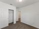 Spacious bedroom with carpet flooring, double door closet and an additional door at 1167 Foreshore Ln, Haines City, FL 33844