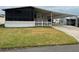 Single-wide manufactured home with carport and fenced yard at 1785 Quail Hill Dr, Lakeland, FL 33810