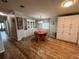 Cozy dining area with wood flooring and white cabinets at 1785 Quail Hill Dr, Lakeland, FL 33810