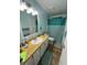 Clean bathroom with updated vanity and chevron shower curtain at 1785 Quail Hill Dr, Lakeland, FL 33810