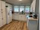 White kitchen with ample counter space and stainless steel appliances at 1785 Quail Hill Dr, Lakeland, FL 33810